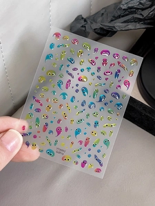3D embossed nail stickers featuring colorful funny cartoon monster eye designs and raindrop patterns