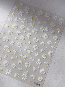 5D embossed white daisy nail stickers with yellow centers and 3D floral relief textures