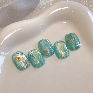 Summer ocean gold fish nail stickers with shimmering blue glitter and white stars