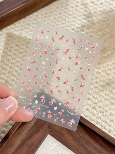 Close-up of YT5038 koi fish and seashell nail art stickers with iridescent details