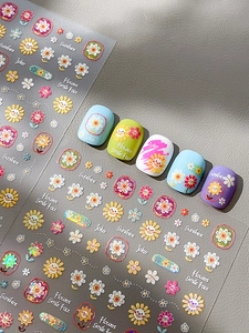 Detailed relief sunflower nail art stickers with 3D colorful floral patterns and smileys