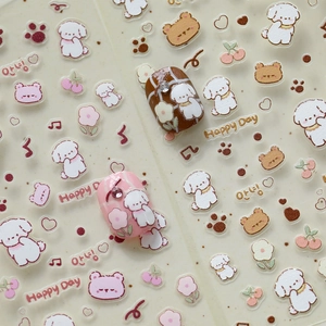 Macro detail of 3D embossed nail stickers featuring cute cartoon dogs and flower patterns