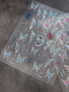 Macro shot of Dream and Classical laser holographic butterfly nail stickers with star details