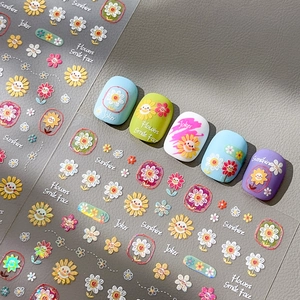 Embossed sunflower and daisy nail stickers with English text and colorful floral motifs