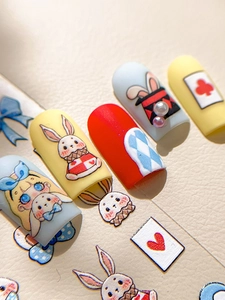 Detail of Alice in Wonderland themed embossed 3D nail art stickers with rabbit motifs
