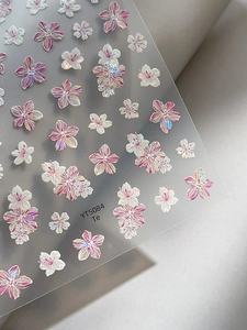 Macro detail of YT5084 floral nail stickers with iridescent cherry blossom designs
