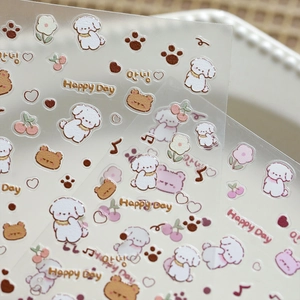 Macro shot of cute cartoon dog and floral PET nail stickers with transparent finish