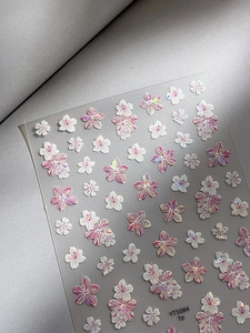 Macro detail of YT5084 3D embossed shell flower nail art stickers with pink gradient effects