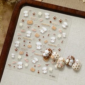 Macro shot of 3D relief nail stickers featuring cute cartoon dogs and flower patterns