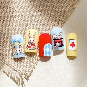 3D cartoon rabbit nail art set featuring Alice in Wonderland style blue and yellow patterns