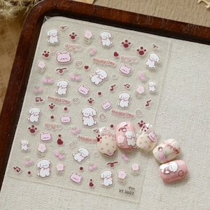 Detail of YT3603 embossed cartoon dog nail stickers with floral patterns on fake nails