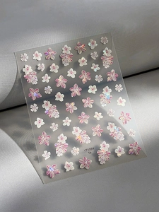 Detailed macro view of 5D cherry blossom embossed nail stickers with pearlescent finish