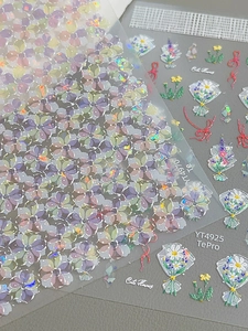 Detailed holographic nail stickers featuring purple floral and daisy bouquet designs