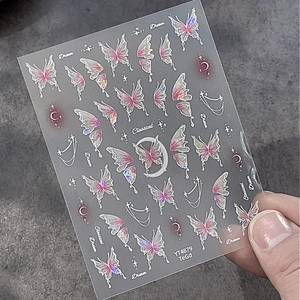 Dreamy butterfly nail art sticker with holographic purple laser finish and moon star patterns