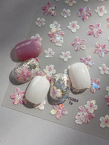 Detailed view of 5D embossed cherry blossom nail stickers with purple and white laser finish