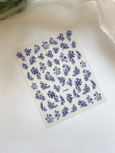 Blue floral porcelain style nail stickers with vintage patterns on white background