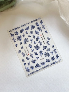 Detail of blue porcelain nail art sticker with peony flowers and butterflies YT5040