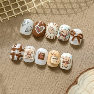 Set de faux ongles avec motifs d'oursons 3D et nœuds marron dans des tons café
