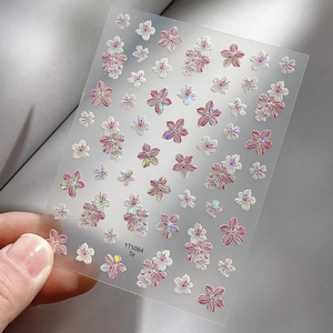 Iridescent cherry blossom nail art stickers with laser floral patterns on transparent sheet