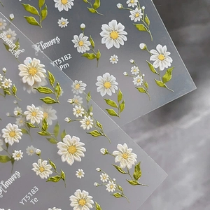 3D embossed daisy nail art stickers with white flowers and green leaves on clear base