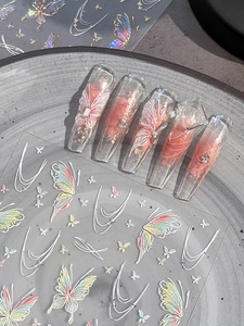 Detailed 5D embossed butterfly nail stickers with colorful gradients on long nail tips