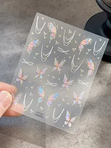 Detailed close-up of iridescent butterfly nail stickers with gold foil outlines