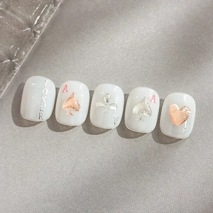 Rose gold and silver poker theme nail stickers with 3D hearts and joker patterns