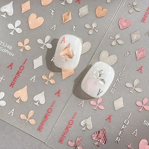 Metallic rose gold and silver poker themed nail art stickers with heart and ace designs