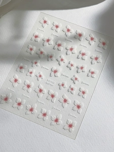 Detailed 5D embossed nail stickers featuring translucent white cherry blossom patterns