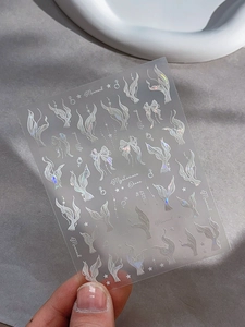 Gros plan d'autocollants pour ongles laser holographiques motif sirène et étoiles YT5257