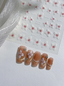 Detailed 3D embossed white flower nail stickers with pink gradient and pearl accents