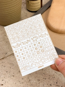 Detail of YITU-7 nail stickers with gold butterfly and flower patterns on white base