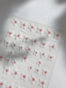 Detailed 5D relief texture of cherry blossom nail stickers with white and pink flower petals