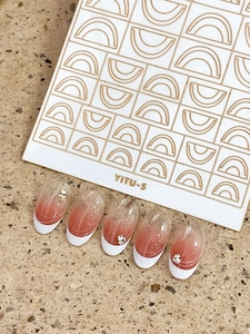 Detail of YITU-5 nail stickers with red-brown gradient french tips and silver rhinestones