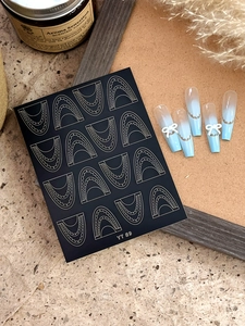 Detailed view of blue and white gradient press-on nails with 3D bows and art stickers