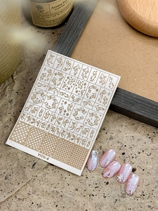 Detail of YITU-6 gold koi fish nail stickers with embossed 3D seashell nail art tips