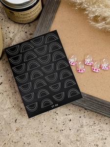 Detail of YT 90 nail art stickers with silver arcs and pink plaid French tips on nails