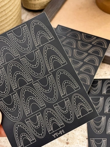 Detail of YT-91 lace pattern nail art stickers with white wave lines on black base