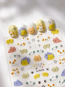 Detail of cute silver-stamped cartoon cat nail stickers with macaron color star patterns