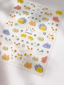 Detailed macro view of 3D embossed silver cartoon cat and star nail art stickers