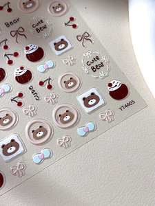 Détail d'autocollants 3D en relief avec ours mignons et motifs de nœuds et cerises