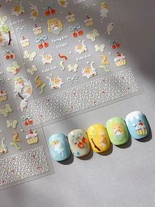Detail of 3D embossed nail stickers featuring Spring Cat, cupcakes and cherry patterns