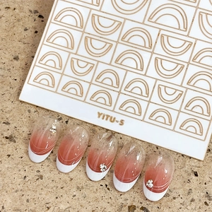 Minimalist gradient French nail stickers with golden curved lines and silver rhinestones