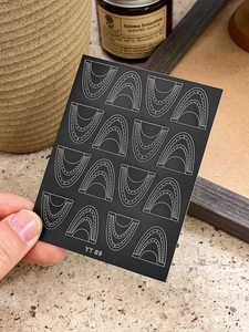Detailed view of YT 89 lace nail stickers featuring white geometric wave patterns
