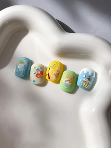 Close-up of cute cartoon cat nail art stickers with 3D embossed texture on white tray