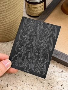 Detail of YT-91 minimalist lace nail sticker with white geometric waves on black background