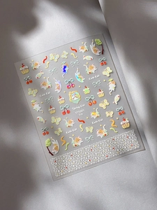 Close-up of cute cartoon cat nail stickers with iridescent finish and cherry motifs