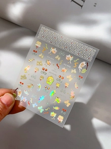 Detail of cute laser cat nail stickers with colorful holographic floral and cherry designs