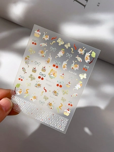 Macro shot of YT5002 Spring Cat nail stickers with cute ginger cats and glitter finish