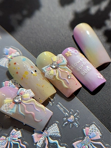 Detail of macaron gradient nail stickers with 3D lace bows and sparkling rhinestones